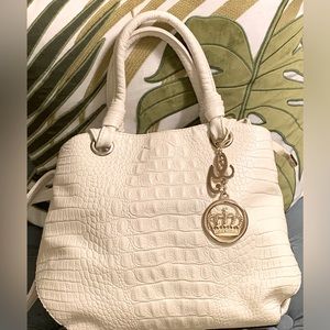 Really pretty white alligator-like purse with gold hardware and decor.